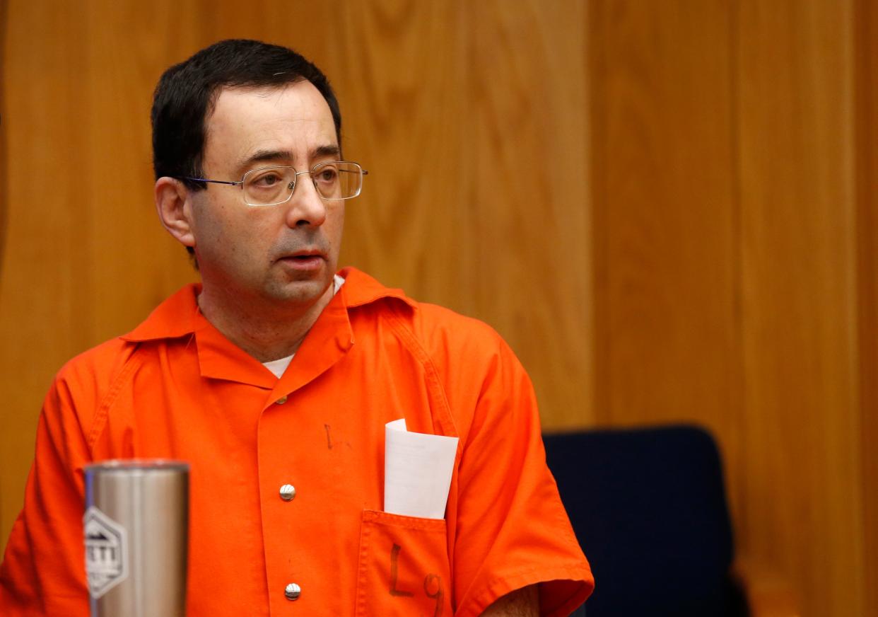 Former Michigan State University and USA Gymnastics doctor Larry Nassar listens during the sentencing phase in Eaton, County Circuit Court on January 31, 2018 in Charlotte, Michigan. 
The number of identified sexual abuse victims of former USA Gymnastics doctor Larry Nassar has grown to 265, a Michigan judge announced Wednesday as a final sentencing hearing commenced. Prosecutors said at least 65 victims were to confront Nassar in court, in the last of three sentencing hearings for the disgraced doctor who molested young girls and women for two decades in the guise of medical treatment.
 / AFP PHOTO / JEFF KOWALSKY        (Photo credit should read JEFF KOWALSKY/AFP via Getty Images)