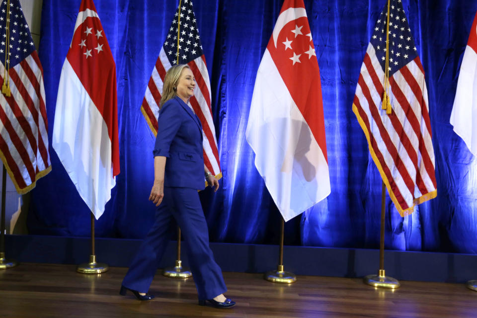 U. S. Secretary of State Hillary Rodham Clinton walks on stage before speaking at Singapore Management University, Saturday, Nov. 17, 2012, in Singapore. (AP Photo/Matt Rourke, Pool)