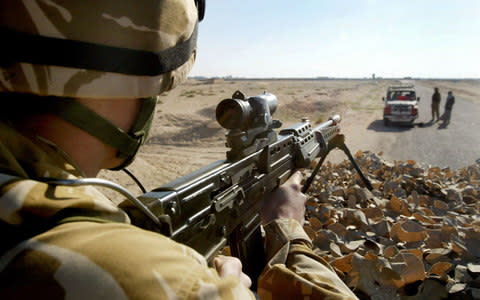 Troops keeping the peace in Basra in 2005 - Credit:  TOBY MELVILLE