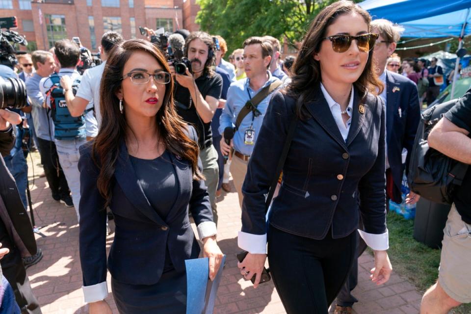 Lauren Boebert and Anna Paulina Luna touirng the George Washington University students encampment on 1 May (AP)