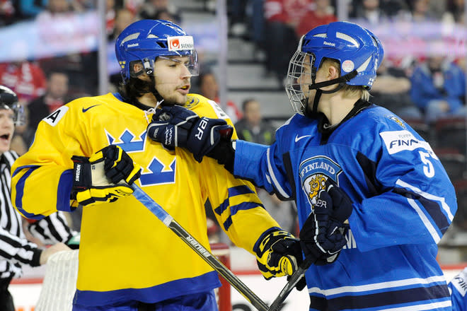 Rasmus Ristolainen #5 Of Team Finland And Ludvig Rensfeldt #23 Of Team Sweden Exchange Words Getty Images