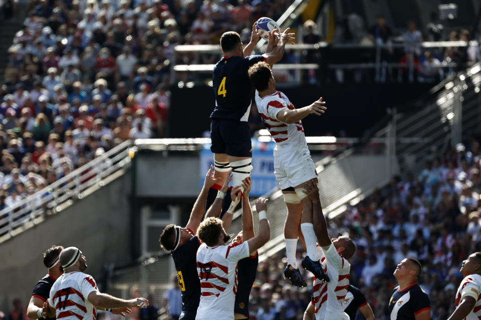 Argentina's Guido Petti Pagadizabal, top left, wins a line out against Japan's Jack Cornelsen during the Rugby World Cup Pool D match between Japan and Argentina, at the Stade de la Beaujoire in Nantes, France, Sunday, Oct. 8, 2023. (AP Photo/Jeremias Gonzalez)