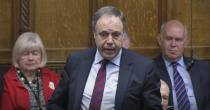 Northern Ireland's DUP (Democratic Unionist Party) deputy leader Nigel Dodds responds to Prime Minister Boris Johnson's statement to lawmakers inside a crowded House of Commons in London, Saturday Oct. 19, 2019. At a rare weekend sitting of Parliament, Johnson implored legislators to ratify the Brexit deal he struck this week with the other 27 EU leaders. (House of Commons via AP)