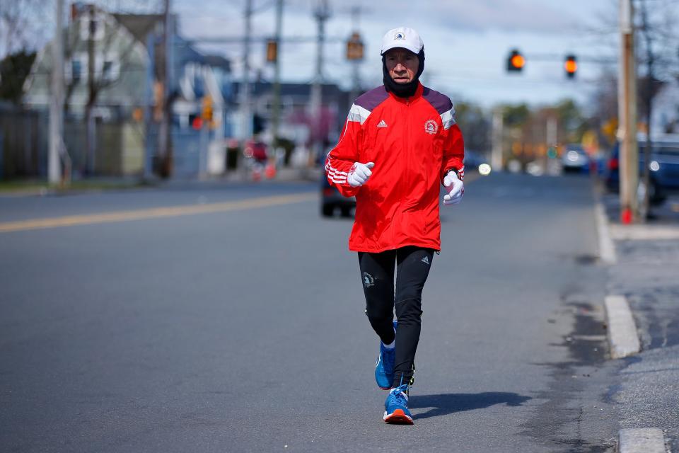 Bill Harrison, 79, runs down Rockdale Avenue in New Bedford as he prepares to run the Boston Marathon again