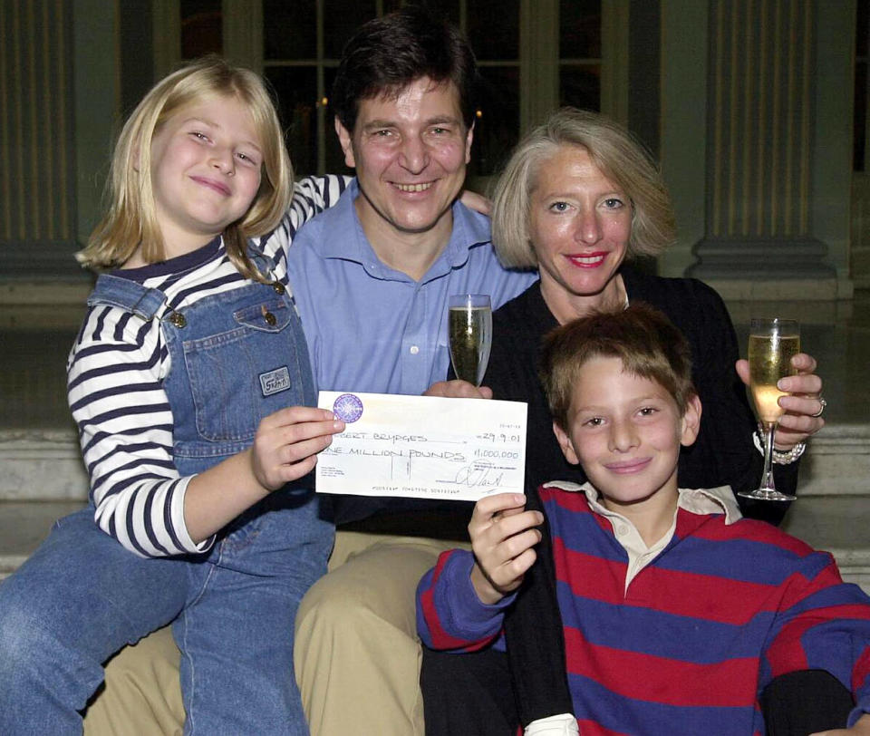 Robert Brydges the latest jackpot winner on Who Wants To Be A Millionaire? with wife Marilyn, his son Kempe, 10, and daughter Catherine, nine, holding the 1 million pound cheque at a press conference in London.    * Mr Brydges, 47, of Holland Park, west London, became the fourth million pound winner of the show, which is due to be transmitted on 29/9/01.   (Photo by Michael Stephens - PA Images/PA Images via Getty Images)