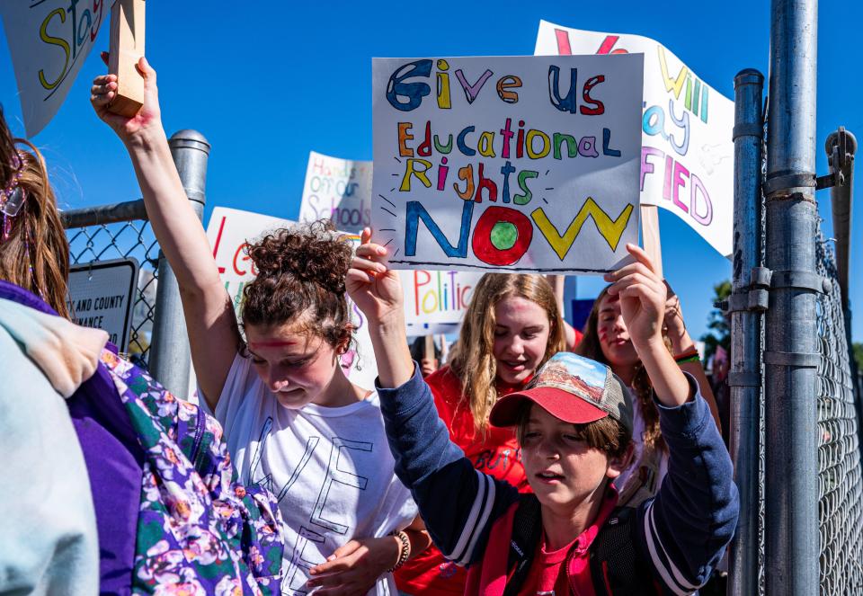 Poudre School District students march along Taft Hill Road to Poudre School District Administration offices on Oct. 9, 2023. Students protested now-paused plans to consolidate their school and others in 2024.