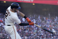 San Francisco Giants' Curt Casali hits an RBI-single against the Los Angeles Dodgers during the third inning of a baseball game in San Francisco, Sunday, Sept. 5, 2021. (AP Photo/Jeff Chiu)