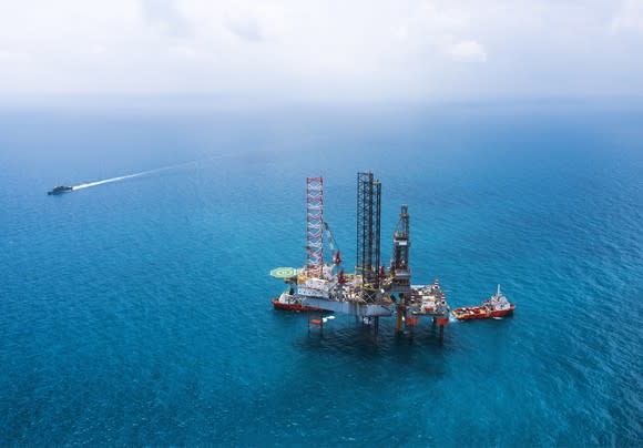 Offshore drilling rig in open water.