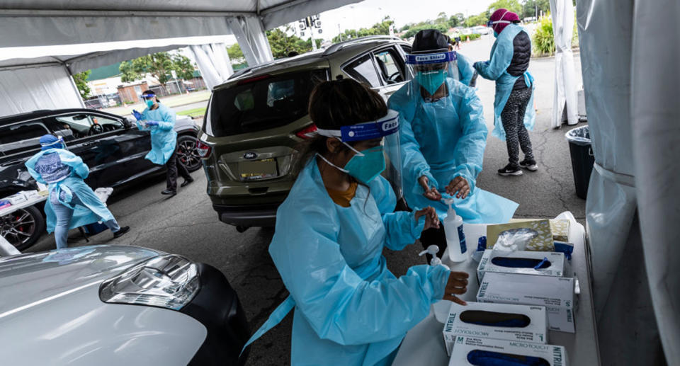 Health workers carry out a Covid-19 testing at the Merrylands drive-through clinic on January 07, 2021 in Sydney, Australia.