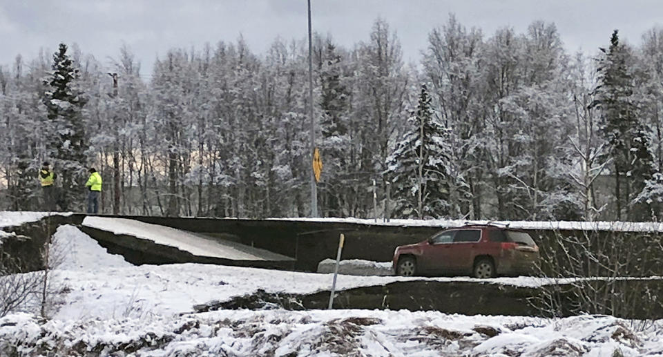 A car is trapped on a collapsed section of a ramp in Anchorage, Alaska, on Friday. (Photo: Dan Joling/AP)