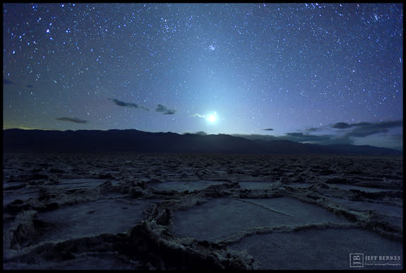 Veteran night sky photographer Jeffrey Berkes captured this stunning view of the ghostly zodiacal light's glow and a crescent moon shining over Badwater Basin in Death Valley National Park in March 2014.