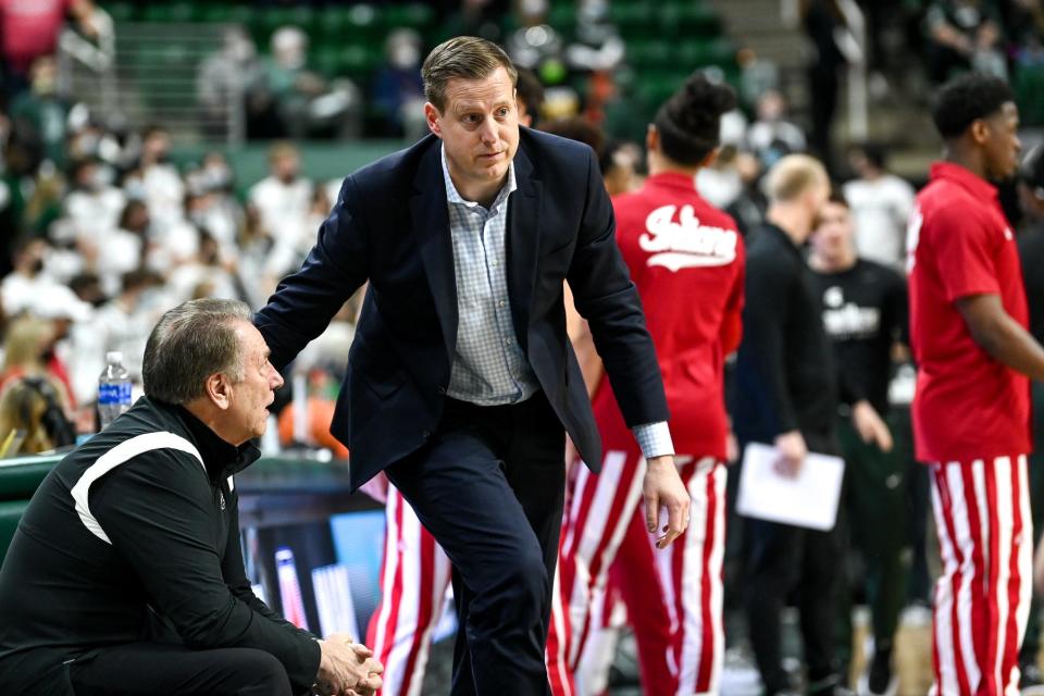 Michigan State's head coach Tom Izzo, left, talks with former assistant coach Dane Fife, now an assistant for the Hoosiers, before the Spartans game against Indiana on Saturday, Feb. 12, 2022, at the Breslin Center in East Lansing.