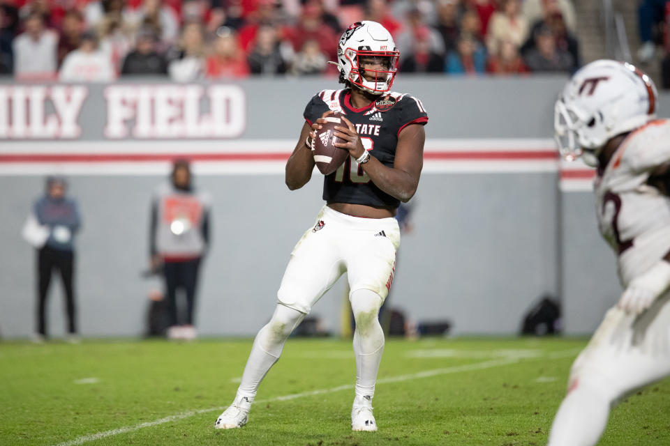 RALEIGH, NC - OCTOBER 27: North Carolina State Wolfpack quarterback MJ Morris (16) stands in the pocket and attempts a pass during a football game between the Virginia Tech Hokies  and the North Carolina State Wolfpack on October 27, 2022, Carter-Finley Stadium at  in Raleigh, NC. (Photo by Charles Brock/Icon Sportswire via Getty Images)