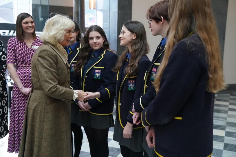 Camilla meets young people during a visit to Aberdeen Art Gallery (PA)