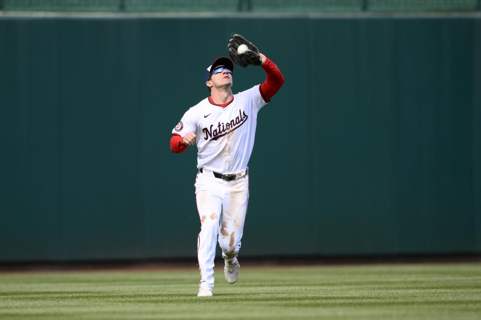 Washington Nationals center fielder Jacob Young makes a catch on a line drive by Philadelphia Phillies' Bryce Harper for an out during the sixth inning of a baseball game, Sunday, April 7, 2024, in Washington. (AP Photo/Nick Wass)