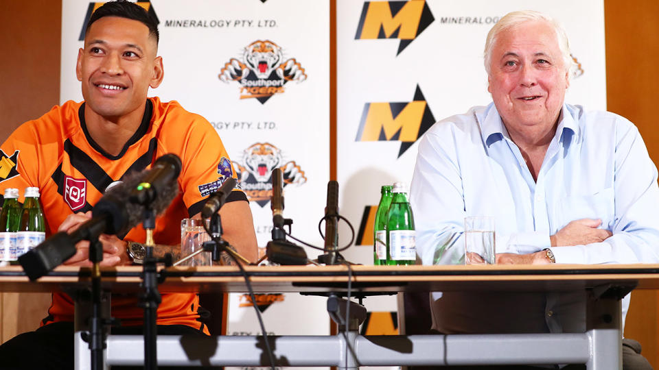 Israel Folau and Clive Palmer, pictured here speaking to the media in Brisbane.