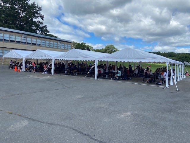 Thomas Jefferson Middle School students eat lunch outdoors Friday.