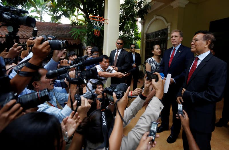 FILE PHOTO: Leader of the Cambodia National Rescue Party (CNRP) Kem Sokha and U.S Ambassador to Cambodia Patrick Murphy listen a question after a meeting in Phnom Penh