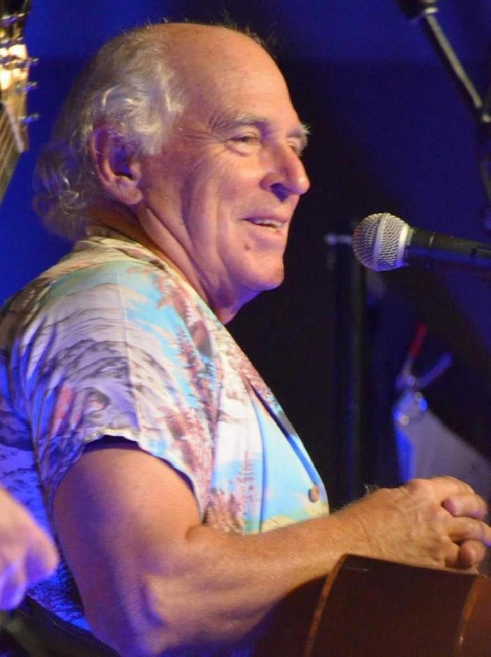 Jimmy Buffett surprised an audience at a small concert at the Grand Magnolia in Pascagoula on Saturday.