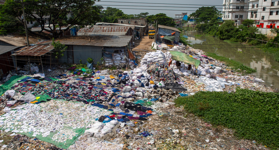 Piles of clothes outside in Bangladesh.