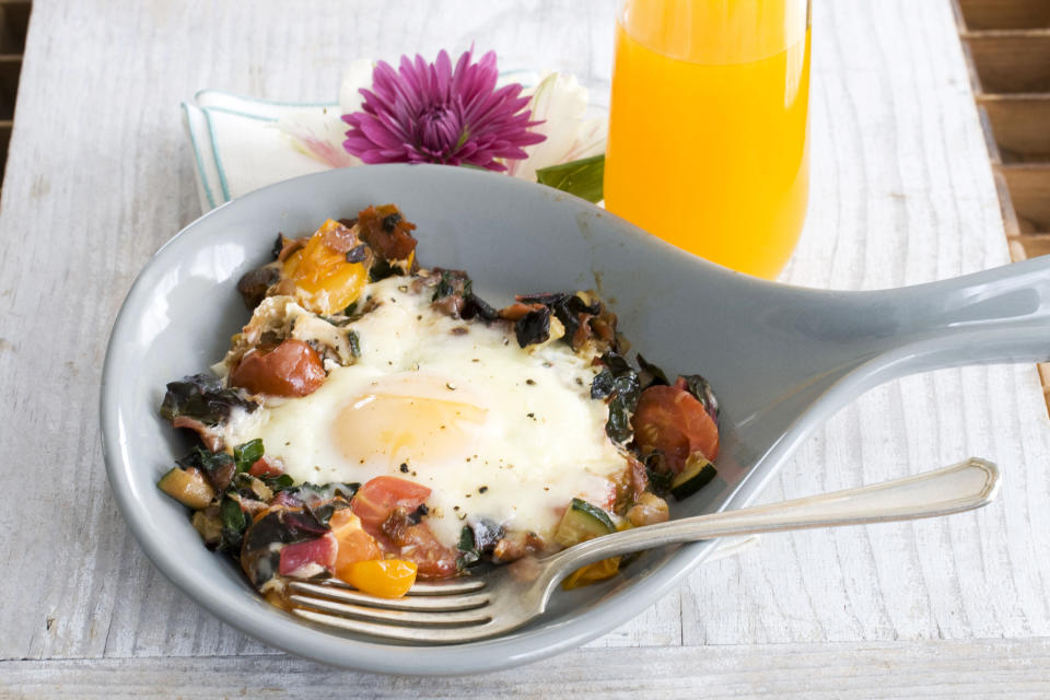 In this image taken on April 15, 20133, skillet garden eggs with fontina are shown in Concord, N.H. (AP Photo/Matthew Mead)