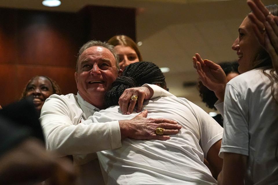 Texas head basketball coach Vic Schaefer hugs point guard Madison Booker after Sunday's announcement that the Longhorns are a No. 1 seed for the NCAA Women's Tournament. Texas hasn't been a No. 1 seed since 2004.