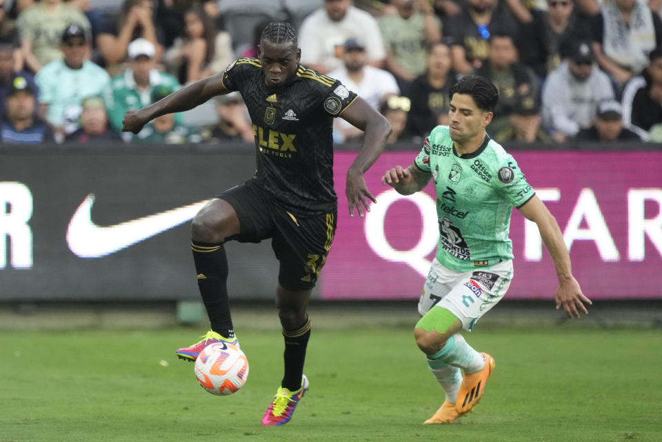 Los Angeles FC defender Jesús Murillo (3) controls the ball against Leon forward Victor Davila (7) during the first half in the second leg of a CONCACAF championship final soccer match, Sunday, June 4, 2023, in Los Angeles. (AP Photo/Marcio Jose Sanchez)