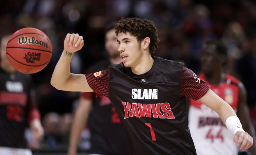 FILE - In this Nov. 17, 2019, file photo, LaMelo Ball of the Illawarra Hawks warms up before their game against the Sydney Kings in the Australian Basketball League in Sydney. LaMelo Ball's bid to be a club owner in Australia hasn't worked out. The American is expected to be a top pick in the upcoming NBA draft later this year.(AP Photo/Rick Rycroft, File)