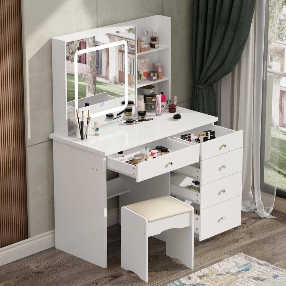 <p><a href="https://go.redirectingat.com?id=74968X1596630&url=https%3A%2F%2Fwww.homedepot.com%2Fp%2FFUFU-GAGA-5-Drawers-White-Makeup-Vanity-Sets-Dressing-Table-Sets-with-LED-Dimmable-Mirror-Stool-and-3-Tier-Storage-Shelves-KF210141-01%2F318504099&sref=https%3A%2F%2Fwww.cosmopolitan.com%2Flifestyle%2Fa42827247%2Fpresidents-day-furniture-sale%2F" rel="nofollow noopener" target="_blank" data-ylk="slk:Shop Now;elm:context_link;itc:0;sec:content-canvas" class="link ">Shop Now</a></p><p>Vanity Mirror</p><p>$223.49</p><p>homedepot.com</p>