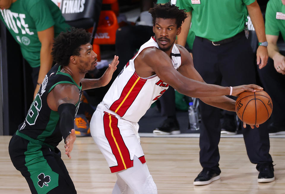 Jimmy Butler #22 of the Miami Heat handles the ball as Marcus Smart #36 of the Boston Celtics defends during the third quarter in Game Two of the Eastern Conference Finals.