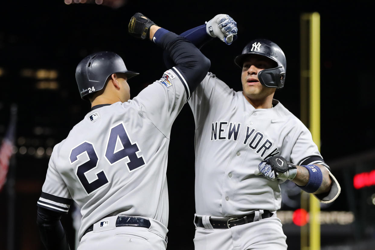 MINNEAPOLIS, MINNESOTA - OCTOBER 07: Gleyber Torres #25 of the New York Yankees celebrates with Gary Sanchez #24 after his solo home run off Jake Odorizzi #12 of the Minnesota Twins in the second inning in game three of the American League Division Series at Target Field on October 07, 2019 in Minneapolis, Minnesota. (Photo by Elsa/Getty Images)