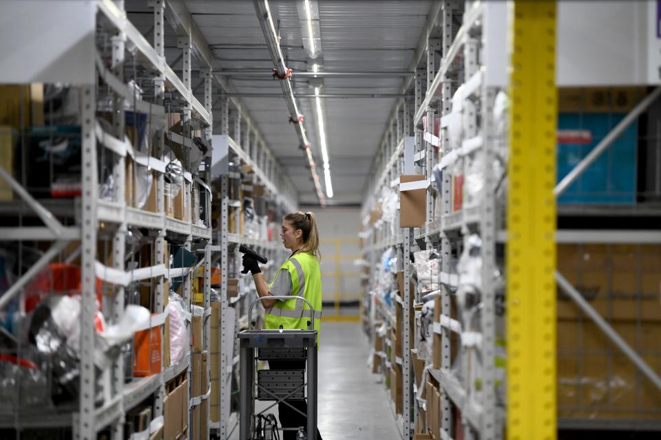 An Amazon employee works on the mezzanine at Amazon.