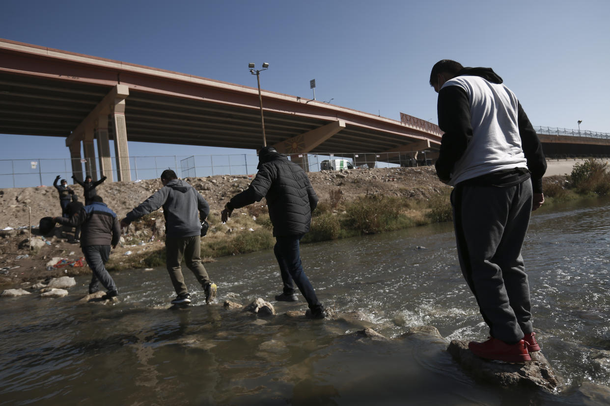 Migrants walk towards the U.S.-Mexico border in Ciudad Juarez, Mexico, Monday, Dec. 19, 2022. Pandemic-era immigration restrictions in the U.S. known as Title 42 are set to expire on Dec. 21. (AP Photo/Christian Chavez)