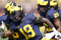 Michigan defensive back Rod Moore reacts after his interception during the first half of an NCAA college football game against Colorado State, Saturday, Sept. 3, 2022, in Ann Arbor, Mich. (AP Photo/Carlos Osorio)