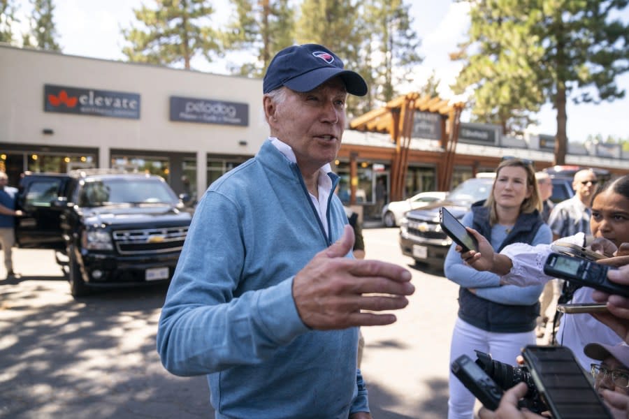 President Joe Biden talks with reporters after taking a Pilates and spin class at PeloDog, Friday, Aug. 25, 2023, in South Lake Tahoe, Calif. (AP Photo/Evan Vucci)
