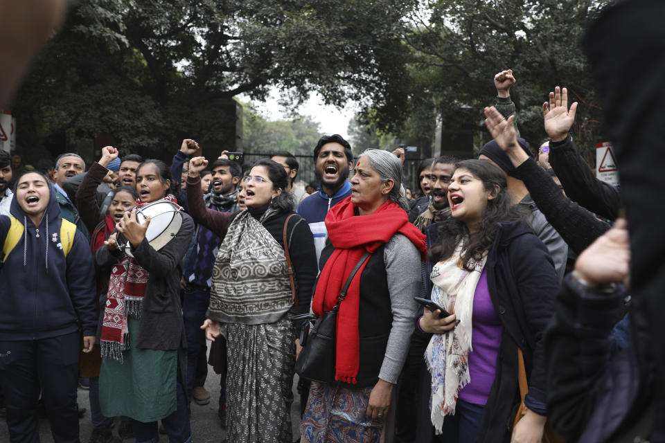 Student and activists shout slogans outside the Jawaharlal Nehru University in New Delhi, India, Monday, Jan. 6, 2020. Masked assailants beat students and teachers with sticks on the campus of a prestigious university in India’s capital, injuring more than 20 people in an attack opposition lawmakers are trying to link to the government. (AP Photo/Altaf Qadri)