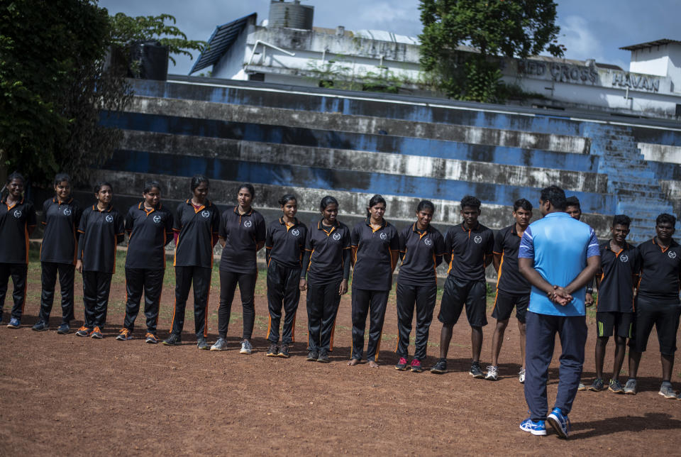 Indian youth aspiring to join the military listen to an instructor as they undergo physical training in Kochi, southern Kerala state, India, Wednesday, Aug. 10, 2022. As factory and private sector employment shrink, young jobseekers increasingly are targeting government jobs, coveted for their security, prestige and benefits. In June, the Indian government overhauled military recruitment to cut costs and modernize, changing long-term postings into four-year contracts after which only 25% of recruits will be retained. The country marks 75 years of independence from British rule on Aug. 15. (AP Photo/R S Iyer)