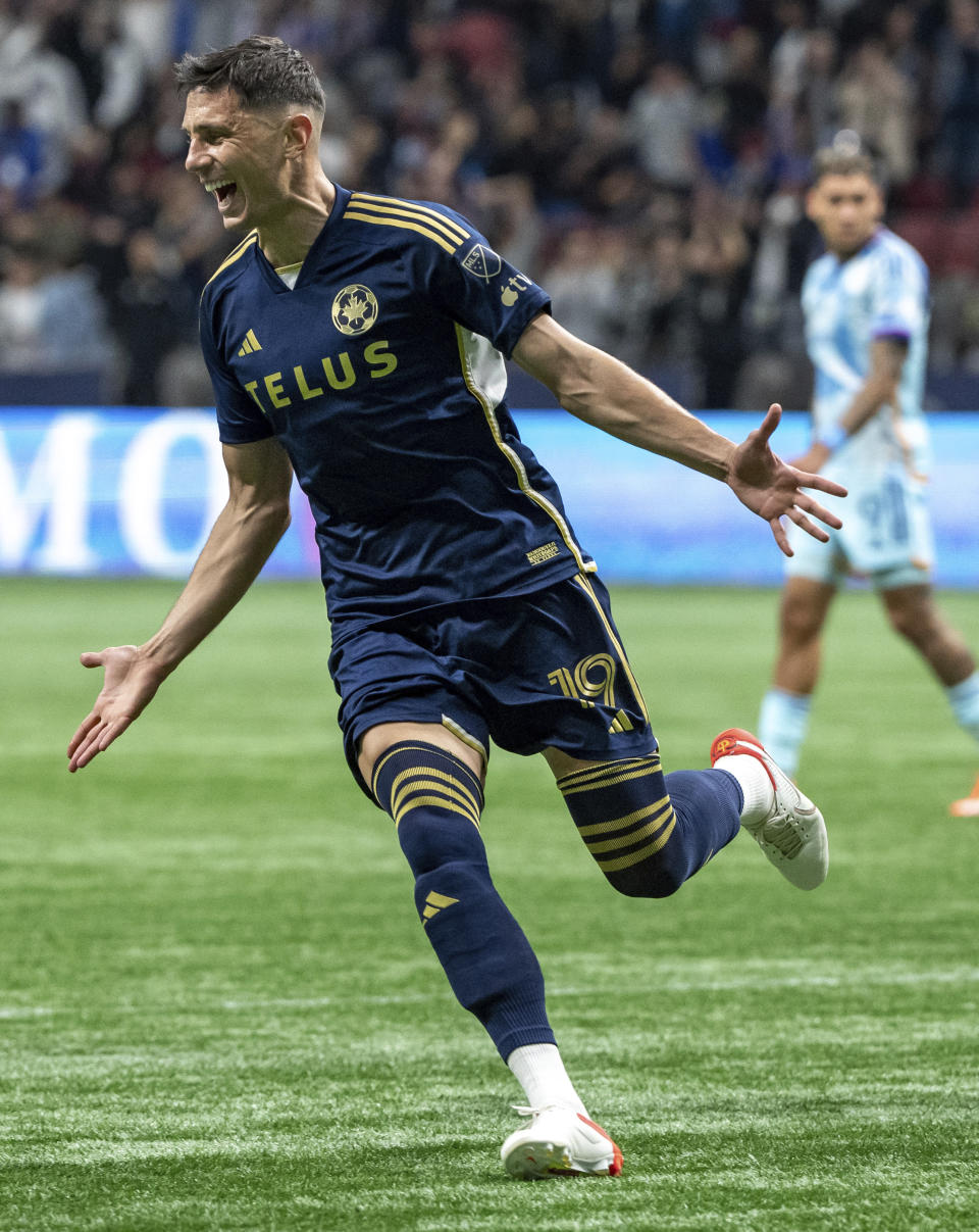 Vancouver Whitecaps' Damir Kreilach celebrates after scoring against the Colorado Rapids during the second half of an MLS soccer match Saturday, June 1, 2024, in Vancouver, British Columbia. (Ethan Cairns/The Canadian Press via AP)