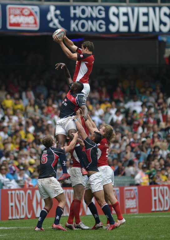 Hong Kong (blue) and Canada (red) compete in a line-out during the Hong Kong Rugby Sevens tournament, on March 23, 2013. With Sevens making its debut as an Olympic sport in Rio in 2016, coaches and players across the world are setting their sights on a place at the next Games