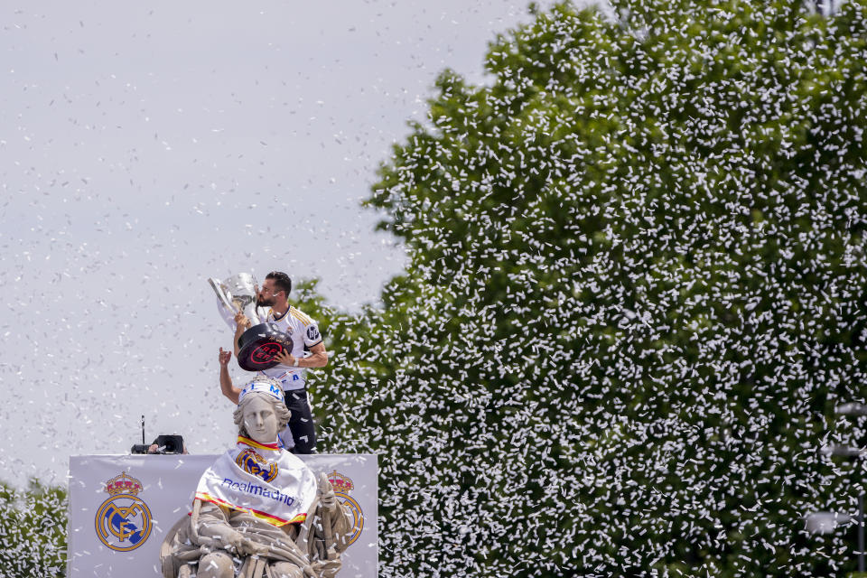 Real Madrid's Nacho Fernandez holds their 36th Liga trophy during celebrations at the Cibeles Square a week after clinching Spanish La Liga soccer title in Madrid, Sunday, May 12, 2024. (AP Photo/Manu Fernandez)