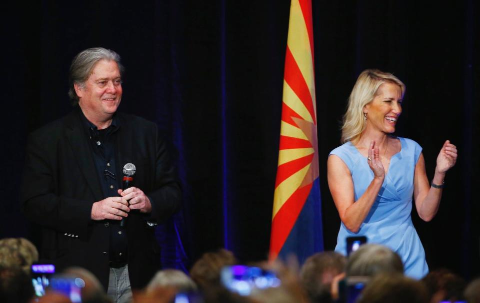 Steve Bannon, former strategist for President Donald Trump, left, joins political commentator Laura Ingraham, right, as they speak at a campaign rally for Arizona Senate candidate Kelli Ward on Tuesday, Oct. 17, 2017, in Scottsdale, Ariz.