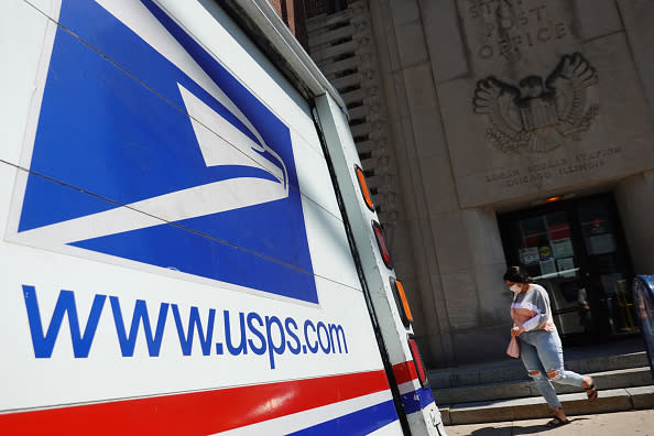 A postal vehicles sits in front of a United State Postal Service facility in Chicago, Illinois.  