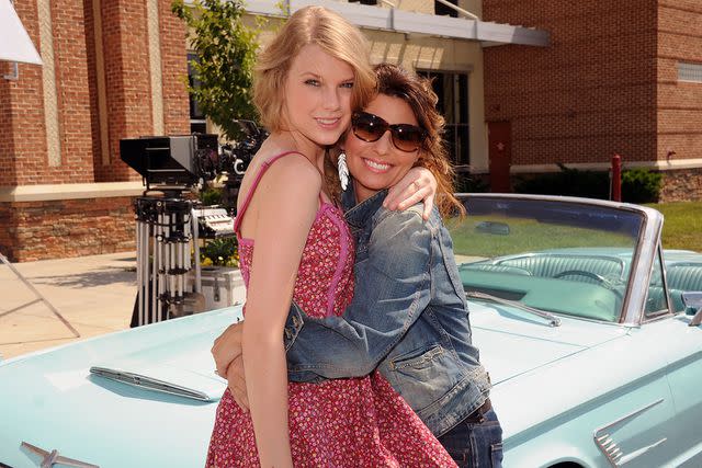 <p>Rick Diamond/Getty</p> Taylor Swift and Shania Twain in Tennessee in June 2011