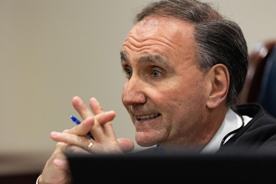 Leon County Circuit Judge Robert Wheeler talks to the prosecution and defense teams before proceeding with the case management hearing for Charlie Adelson, the accused ringleader in the 2014 murder-for-hire of Florida State law professor Dan Markel, Tuesday, Feb. 24, 2023.