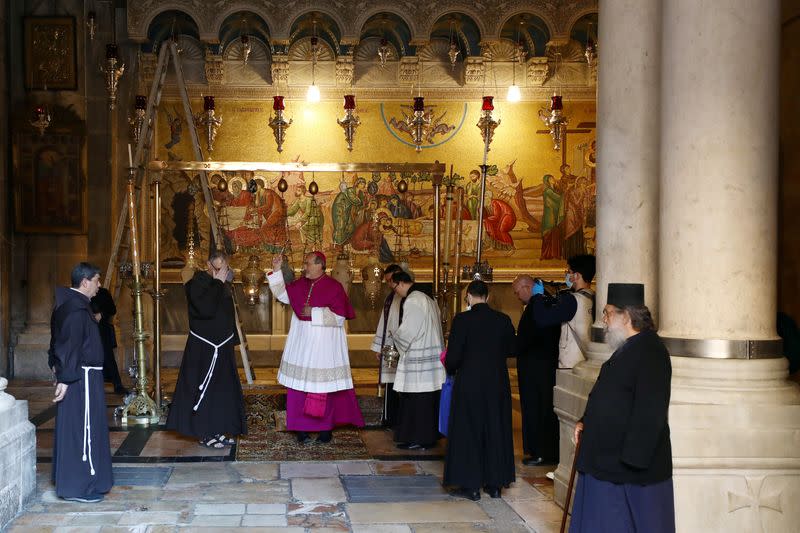 FILE PHOTO: Archbishop Pierbattista Pizzaballa, apostolic administrator of the Latin Patriarchate of Jerusalem stands inside the Church of the Holy Sepulchre amid coronavirus restrictions in Jerusalem's Old City