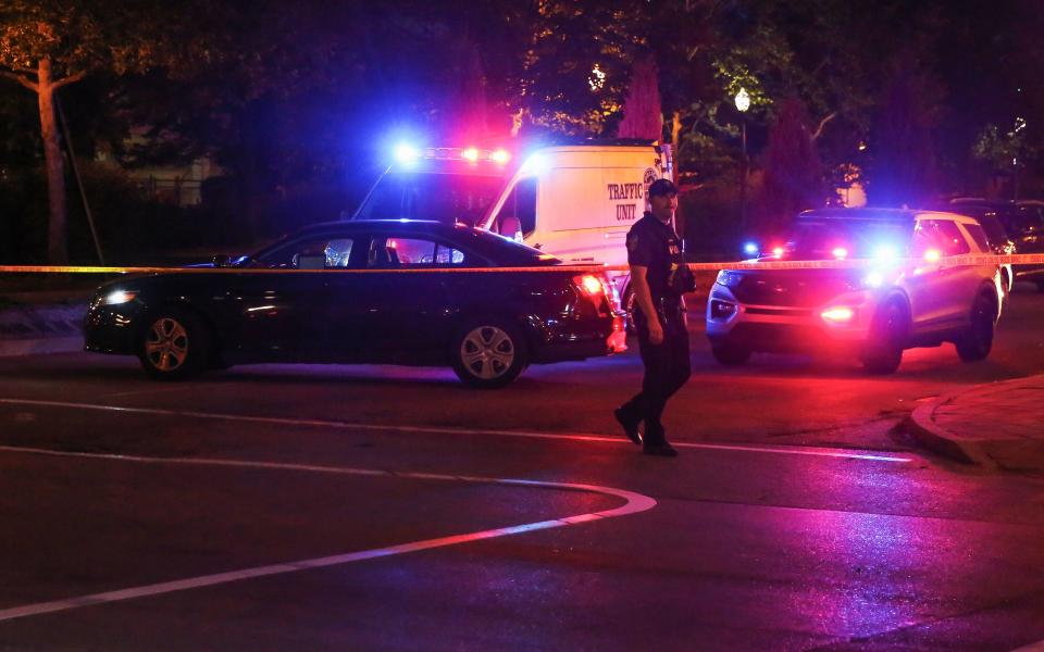 Police officers investigate the scene on Second Street and East Market Street where a driver struck pedestrians in downtown Louisville on July 5, 2022. A man was taken into custody and charged with impairment and three adults and one child were taken to the UofL and Norton Children's Hospital.