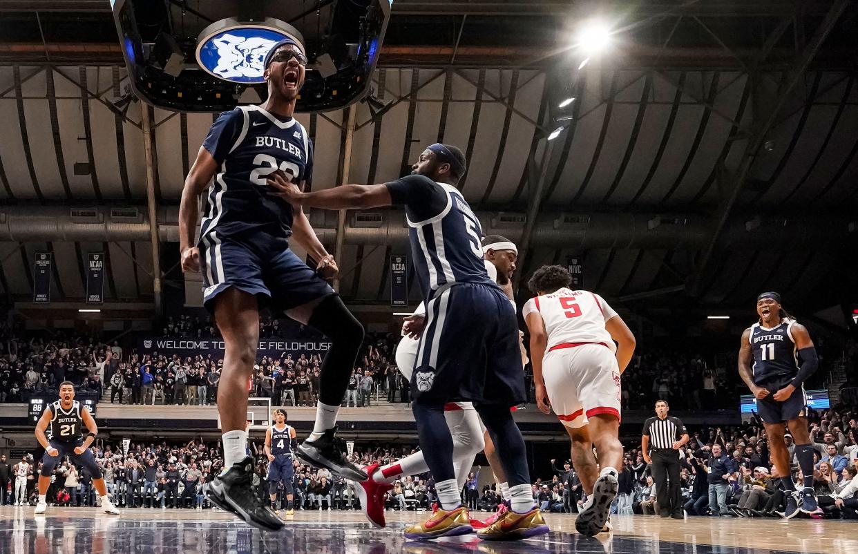 Butler Bulldogs center Andre Screen (23) yells in excitement after dunking the ball Thursday, Nov. 30, 2023, during the game at Hinkle Fieldhouse in Indianapolis. The Butler Bulldogs defeated the Texas Tech Red Raiders in overtime, 103-95.
