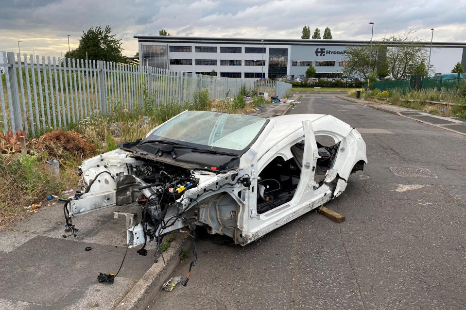 Police are hunting 'car cannibals' after Mercedes Benz was found stripped bare by thieves.  See SWNS story SWMDcar.  The car which was stolen in February was found by police in Birmingham completely stripped, with just the chopped up body frame and windscreen left stradling the road and pavement on an industrial estate. (SWNS)