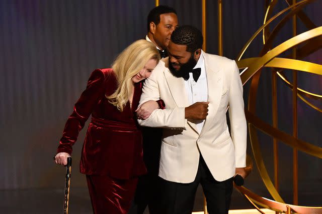 <p>VALERIE MACON/AFP via Getty Images</p> Christina Applegate with Anthony Anderson at the 75th Emmy Awards