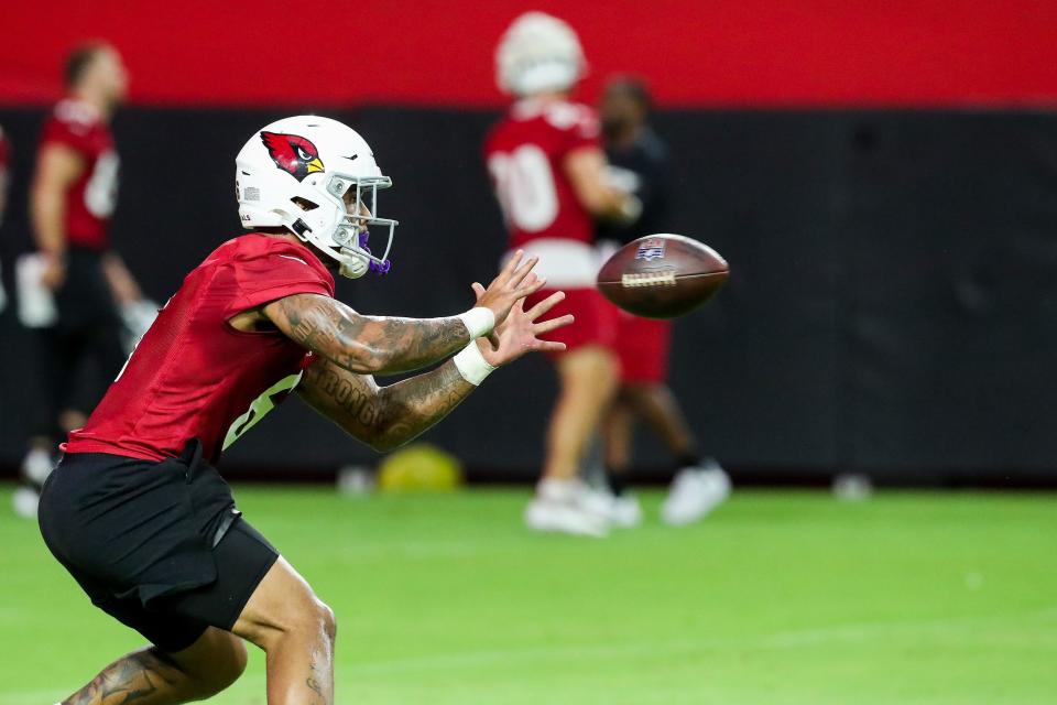 Arizona Cardinals running back James Conner (6) catches the ball during Arizona Cardinals practice at State Farm Stadium on Thursday, July 28, 2022, in Glendale.